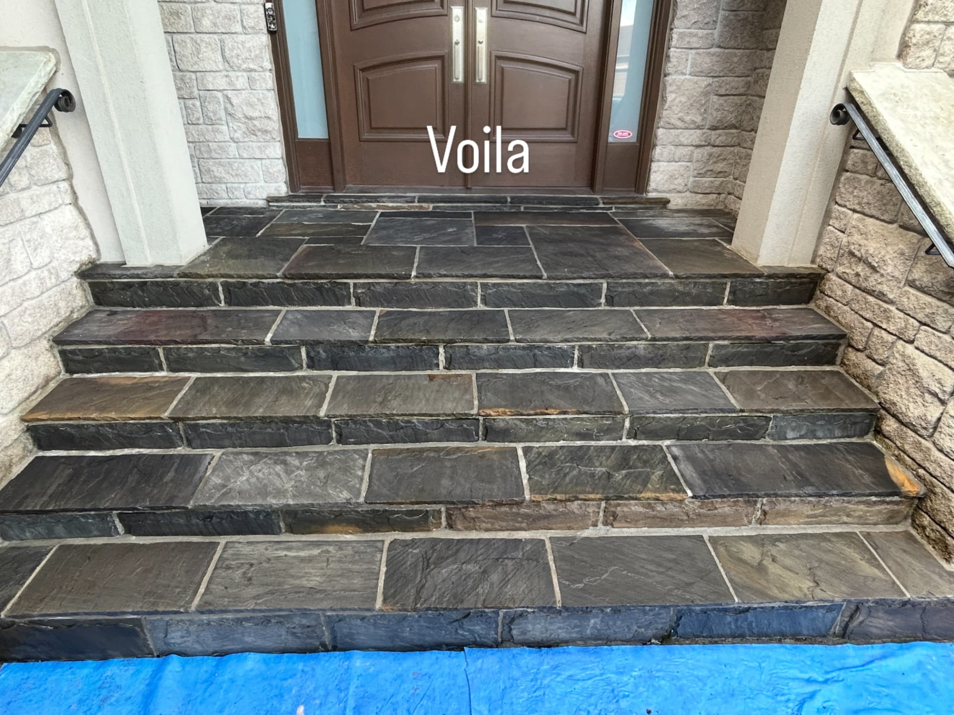 Finished natural-stone entrance steps after restoration